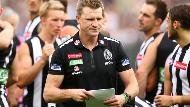 MELBOURNE, AUSTRALIA — MAY 07: Nathan Buckley, coach of the Magpies speaks to his team during a quarter time break during the round seven AFL match between the Collingwood Magpies and the Carlton Blues at Melbourne Cricket Ground on May 7, 2016 in Melbourne, Australia. (Photo by Scott Barbour/Getty Images)