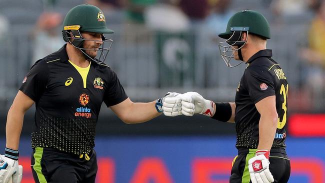 Aaron Finch and David Warner of Australia are seen during the T20 International Cricket match between Australia and Pakistan at Optus Stadium, in Perth, Friday, November 8, 2019. (AAP Image/Richard Wainwright)