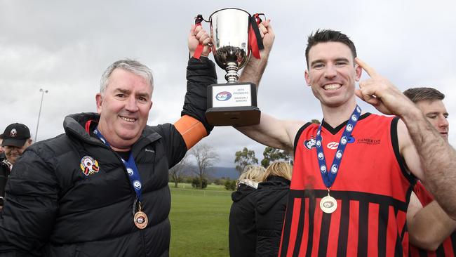 Panton Hill coach Steve Layt and captain Mitchell Anderson with the premiership trophy. Picture: Andy Brownbill