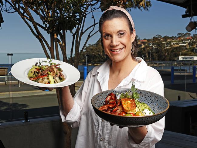 Front of house manager at Robbie Brown's at Kingston, Erin Webb with their seafood salad and "Keto Breaky".  Picture: Zak Simmonds