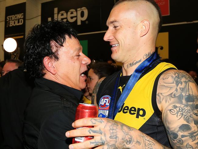 Dustin Martin of the Tigers hugs his manager Ralph Carr after the 2019 AFL Grand Final match between the Richmond Tigers and the GWS Giants at the MCG on September 28, 2019 in Melbourne, Australia. Picture: Mark Stewart