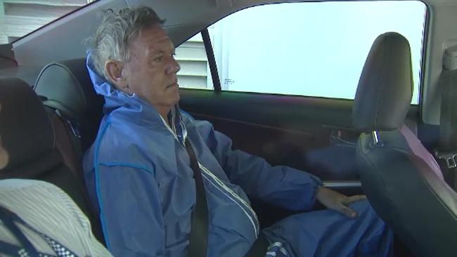 Andrew John Cobby being taken to the Southport Watchhouse to be charged with murder. Photo: 9News Gold Coast