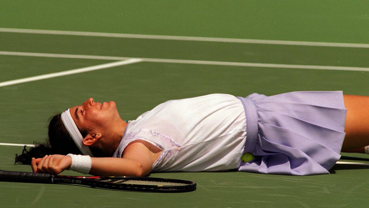 Arantxa Sanchez Vicario lies on the flat on the court during the 1996 Australian Open in Melbourne.