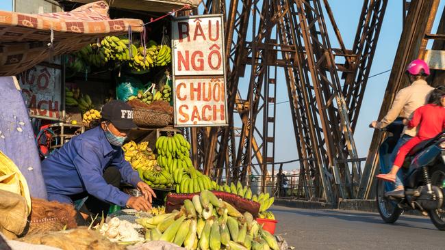 Street fruit vendor stall on Long Bien old bridge