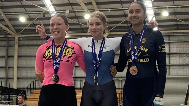 Billie Russell (middle) on the top step of the podium after one of her races at the state titles. Picture: Luke Russell.