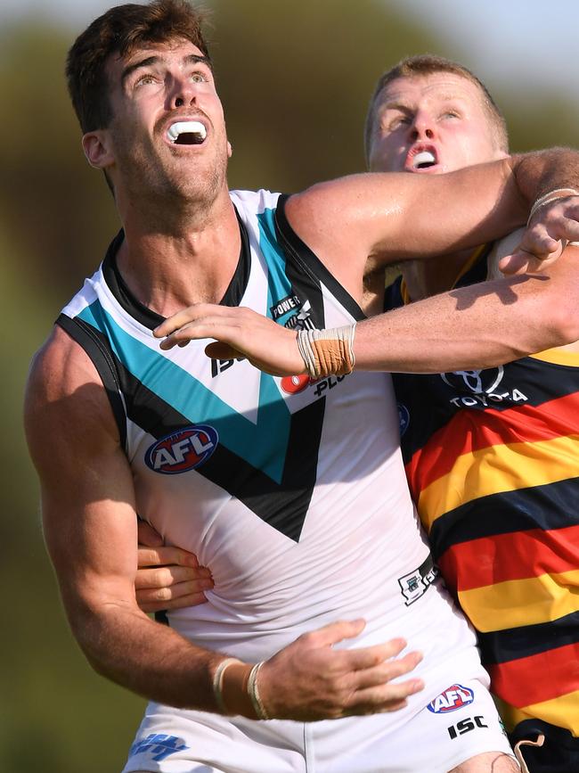 New Port Adelaide ruckman Scott Lycett competes with Adelaide’s Reilly O'Brien at Memorial Oval Port Pire. Picture: Mark Brake/Getty