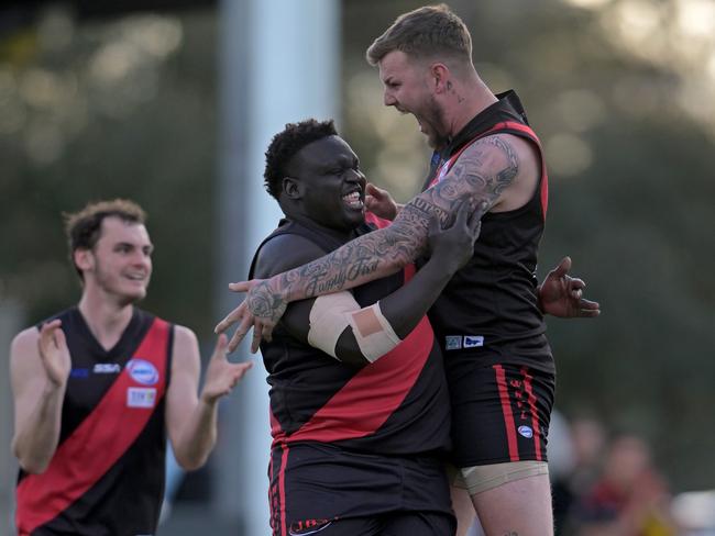 Majok Monydhot celebrates a goal Jayden Hoskin-Elliott. Picture: Andy Brownbill