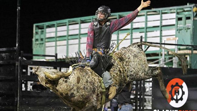 Shane Dyer competes in the Great Northern Bull riding series bull ride event at the Mossman Showgrounds. Picture: Stephen Harman