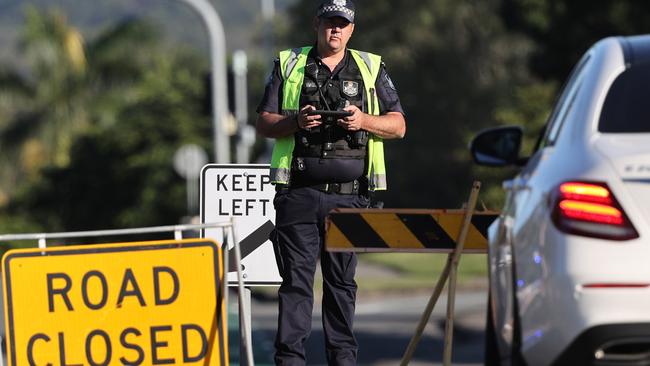 Police at a roadblock as the siege dragged on. Picture: Nigel Hallett