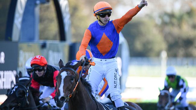 Jockey James Innes Jnr salutes onboard Nettoyer. Picture: AAP/Dan Himbrechts