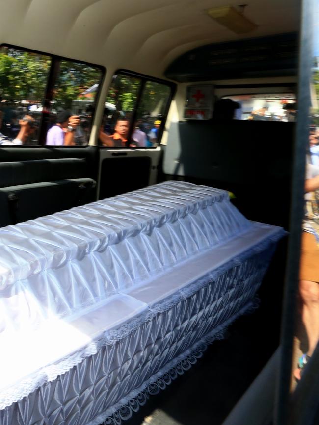 Ambulances arrive at Nusakambangan Port with the coffins inside when Bali 9 ringleaders Myuran Sukumaran and Andrew Chan allng with 7 others will be executed later tonight. Picture: Adam Taylor