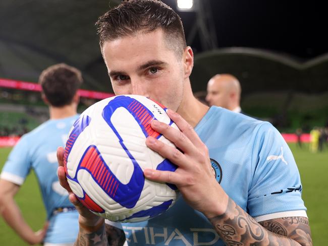 MELBOURNE, AUSTRALIA - APRIL 22: Jamie Maclaren of Melbourne City kisses the match ball after he scored a hat trick to becomes the league's highest goalscorer during the round 25 A-League Men's match between Western United and Melbourne City at AAMI Park, on April 22, 2023, in Melbourne, Australia. (Photo by Robert Cianflone/Getty Images)