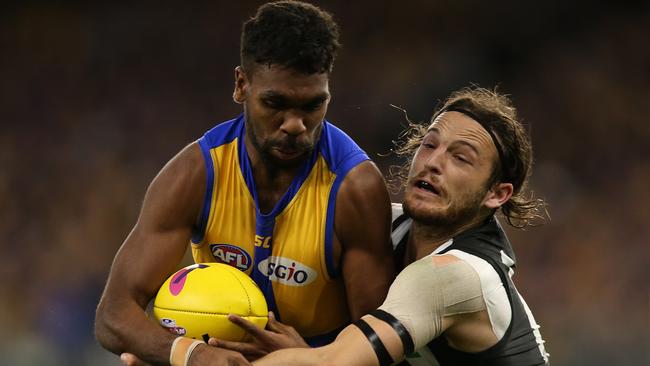 Liam Ryan tries to break a James Aish tackle on Saturday night. Picture: Getty Images