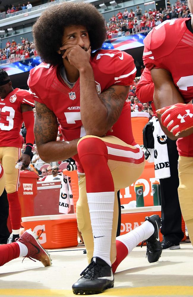 Colin Kaepernick kneels during the national anthem before a San Francisco 49ers game in 2016. Picture: AFP