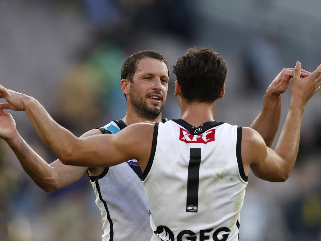 Connor Rozee and Travis Boakembrace after the final siren of Boak’s 350th game. Picture: Darrian Traynor/Getty Images.