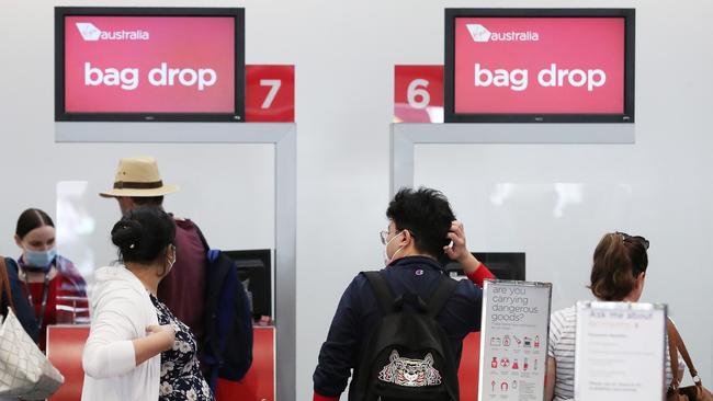 People leaving Brisbane ahead of the Melbourne lockdown, Brisbane Airport. Picture: Liam Kidston