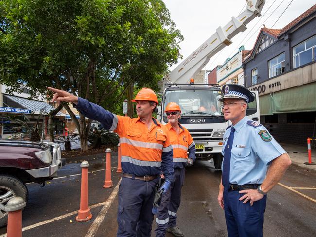 NSW Police Deputy Commissioner Mal Lanyon talking to the Andrew Witchard and Doug Campbell from Essential Energy. Picture: Danielle Smith