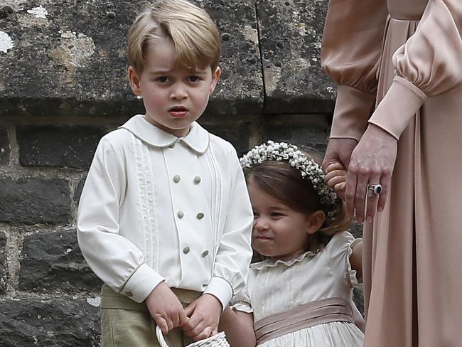 ENGLEFIELD, ENGLAND - MAY 20:  Catherine, Duchess of Cambridge, right, stands with Princess Charlotte and Prince George, who were flower boys and girls at the wedding of Pippa Middleton and James Matthews at St Mark's Church on May 20, 2017 in in Englefield, England. Middleton, the sister of Catherine, Duchess of Cambridge married hedge fund manager James Matthews in a ceremony Saturday where her niece and nephew Prince George and Princess Charlotte was in the wedding party, along with sister Kate and princes Harry and William. (Photo by Kirsty Wigglesworth - Pool/Getty Images)