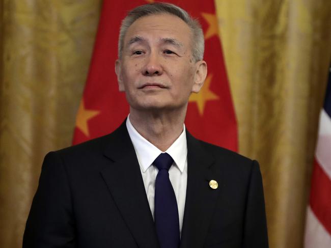 Chinese Vice Premier Liu He listens as President Donald Trump speaks before signing a trade agreement in the East Room of the White House. Picture: AP