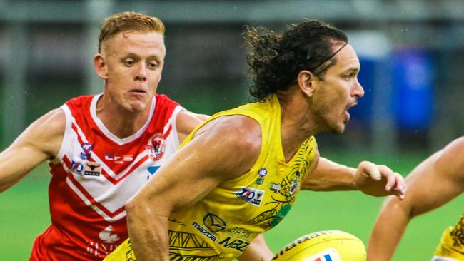 Cameron Ilett (ball) in action in the NT.Picture: Glenn Campbell