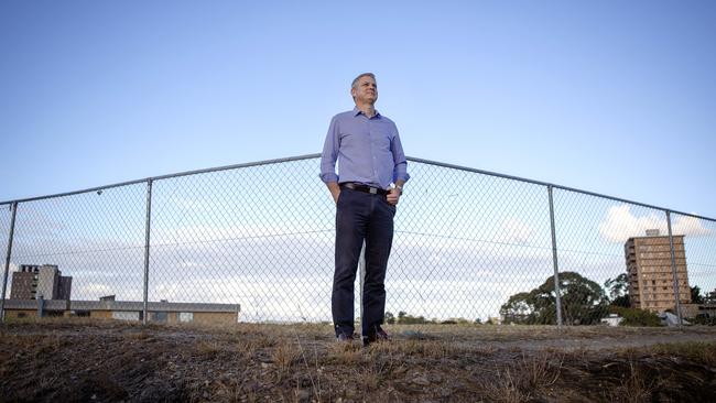 Councillor James Mackay at the site on the corner of Swann and Moggill roads, Taringa. He says Council will need to carefully assess traffic implications. Picture: AAP/Sarah Marshall