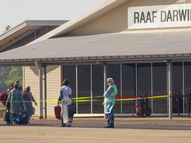 Expatriates collect luggage from their Delhi flight before heading to Howard Springs Quarantine Facility. Picture: ADF