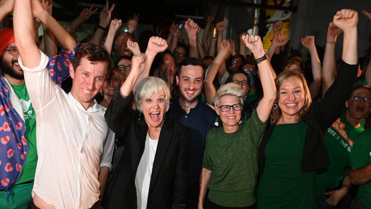 Max Chandler-Mather, Elizabeth Watson-Brown, Stephen Bates, Senator Larissa Waters and Senate candidate Penny Allman-Payne celebrate election results on Saturday night. Picture: Dan Peled/Getty Images