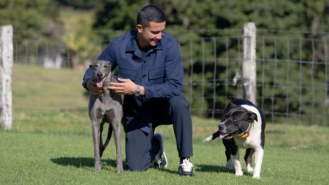 Tim Cahill and his retired greyhound Lumo and Boy Boy at his family farm, Northern NSW Picture Danielle Smith
