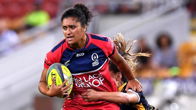 BRISBANE, AUSTRALIA - FEBRUARY 09:  Zahara Temara of Queensland attempts to break free from the defence during the 2018 Global Tens match between Queensland and the ACT Brumbies at Suncorp Stadium on February 9, 2018 in Brisbane, Australia.  (Photo by Bradley Kanaris/Getty Images)