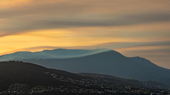 kunanyi/Mount Wellington with smoke from the fires. Picture: GREG SCOTT