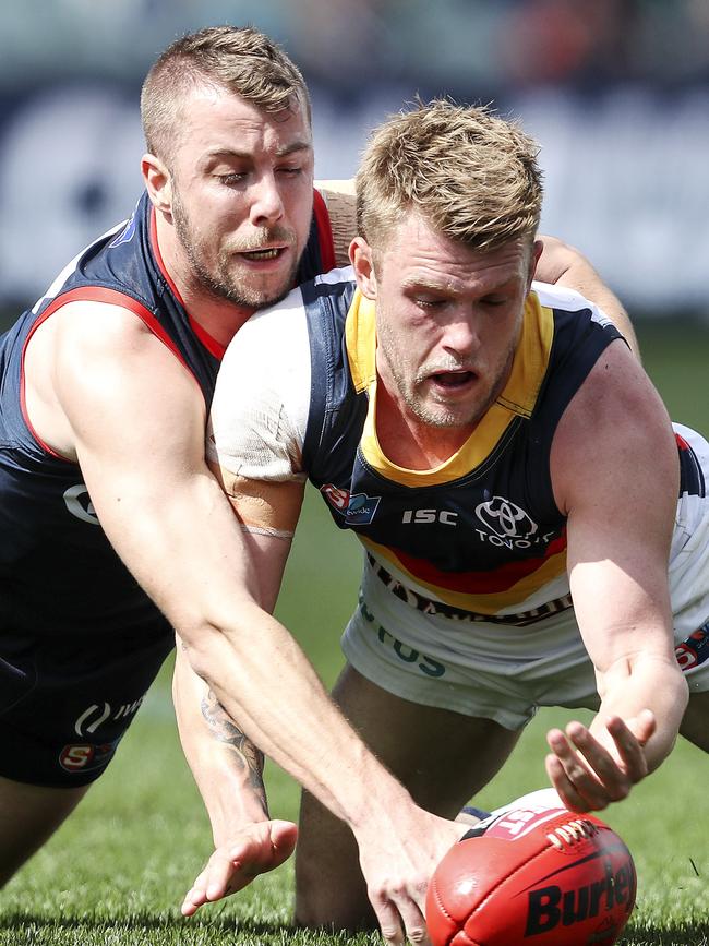 Norwood’s Mitchell Wilkins fights for the footy with Adelaide’s Jackson Press. Picture SARAH REED