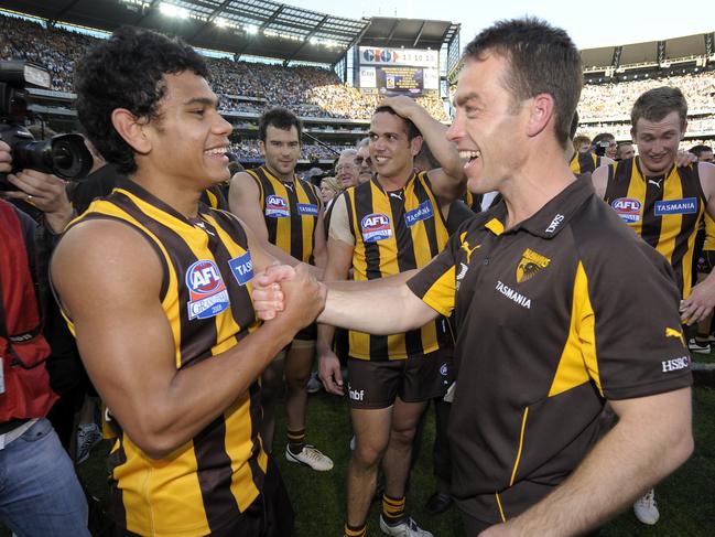 Cyril Rioli and Alastair Clarkson after Hawthorn’s 2008 premiership win.