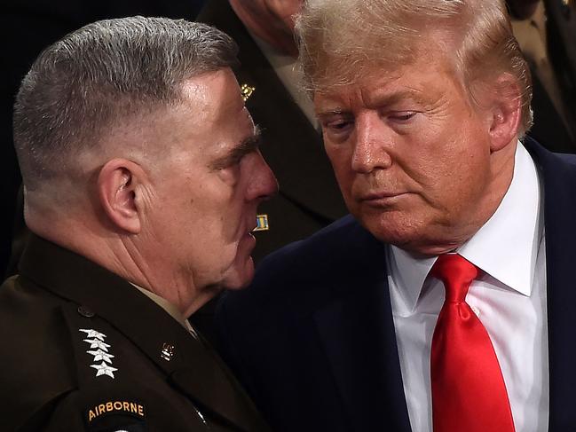 (FILES) In this file photo taken on February 04, 2020, Chairman of the Joint Chiefs of Staff, Army General Mark Milley (L) chats with US President Donald Trump after he delivered the State of the Union address at the US Capitol in Washington, DC. - Milley said his calls to a Chinese counterpart were a normal part of his duties, after a new book reported he secretly contacted Beijing amid worries over Donald Trump's mental state. "His calls with the Chinese and others in October and January were in keeping with these duties and responsibilities conveying reassurance in order to maintain strategic stability," Milley's spokesman Colonel Dave Butler said in a statement. (Photo by Olivier DOULIERY / AFP)