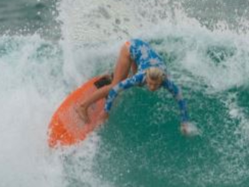 Gidget Kowalski surfing