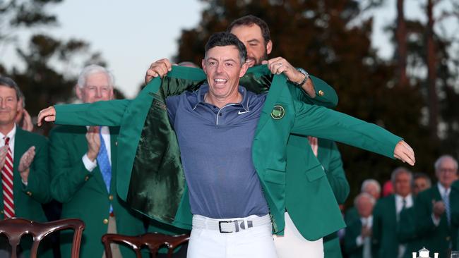 Scottie Scheffler puts the Green Jacket on Rory McIlroy (Photo by Richard Heathcote/Getty Images)
