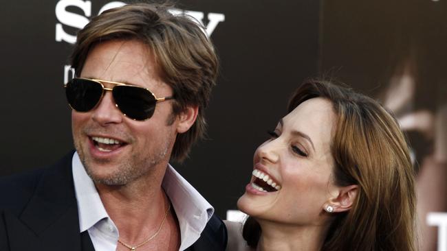 FILE - In this Monday, July 19, 2010, file photo, cast member Angelina Jolie, right and Brad Pitt arrive at the premiere of 