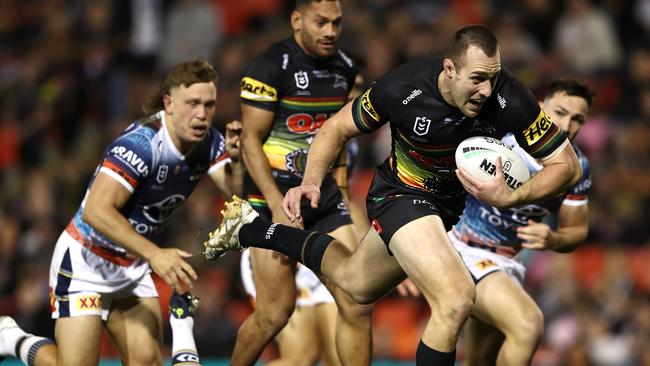 PENRITH, AUSTRALIA - MAY 27: Isaah Yeo of the Panthers breaks a tackle to score a try during the round 12 NRL match between the Penrith Panthers and the North Queensland Cowboys at BlueBet Stadium on May 27, 2022, in Penrith, Australia. (Photo by Matt Blyth/Getty Images)