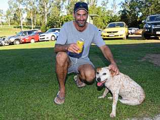 A BLOKE AND HIS DOG: MAFS star Mick Gould watches the footy in Gympie on Saturday afternoon. Picture: Troy Jegers