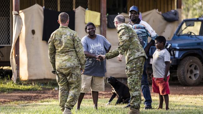 Major Alan Bretherton and Sergeant Chris Diamond meet with some locals in Wudikapildyerr. Picture: Dylan Robinson