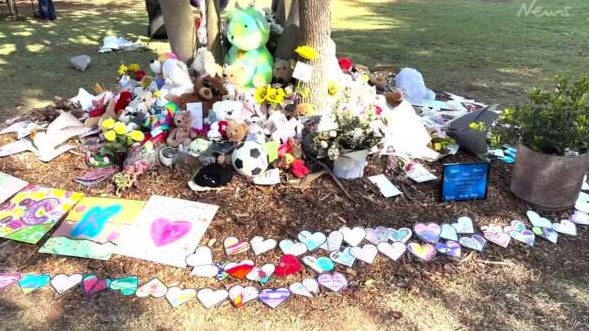 Tributes left for the six people who died in a house fire on Russell Island this month. Picture: News Corp