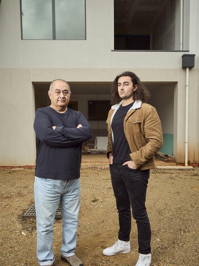 Omid Rad, pictured with son Aria, claims Sangong Homes abandoned the Myrtle Bank building site in March, leaving him with an incomplete townhouse. Picture: Matt Loxton