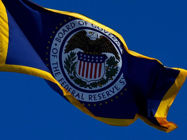 The flag of the Federal Reserve flies on top of its building in Washington, DC, on January 26, 2022. - The conclusion of the Federal Reserve's first policy meeting of the year on Wednesday can't come soon enough for Wall Street, which has experienced days of chaotic trading as investors fret over what steps the central bank might take to counter inflation. (Photo by OLIVIER DOULIERY / AFP)