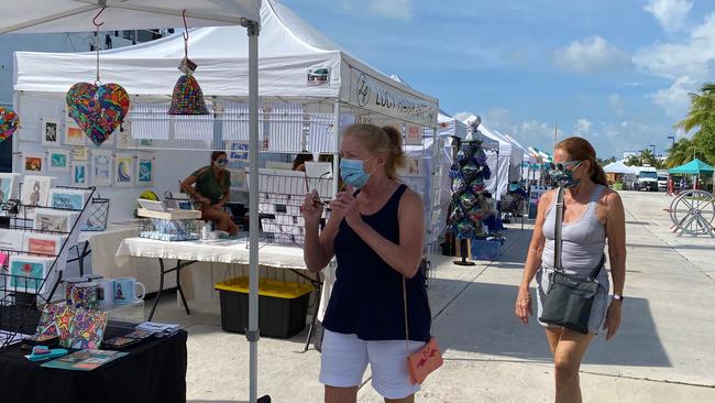 Customers and vendors at the Farmers Market in Key West, Florida. Picture: AFP.