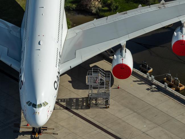 SYDNEY, AUSTRALIA - APRIL 22: A grounded Qantas plane is parked on the tarmac at Sydney Airport on April 22, 2020 in Sydney, Australia. Restrictions have been placed on all non-essential business and strict social distancing rules are in place across Australia in response to the COVID-19 pandemic.  (Photo by Cameron Spencer/Getty Images)