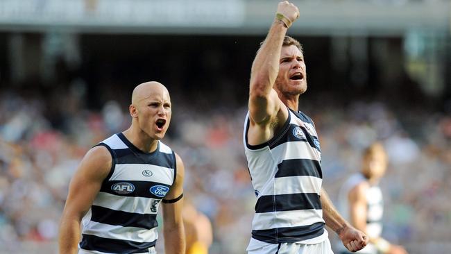 Ablett and Cam Mooney celebrate a Geelong goal.