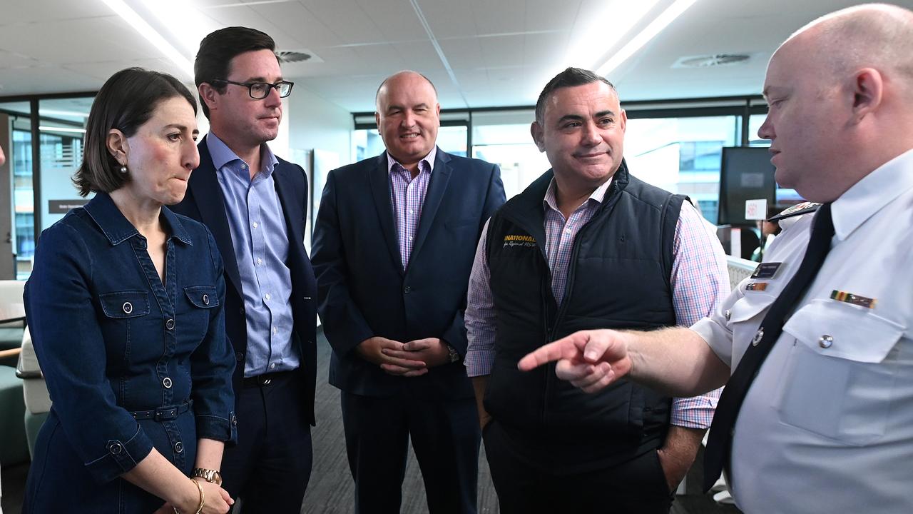 (L-R) NSW Premier Gladys Berejiklian, Federal Minister for Water Resources David Littleproud, NSW Deputy Premier John Barilaro and NSW Police and Emergency Services Minister David Elliott are briefed by Commissioner NSW RFS Shane Fitzsimmons in the NSW Rural Fire Service control room in Sydney. Picture: AAP/Joel Carrett