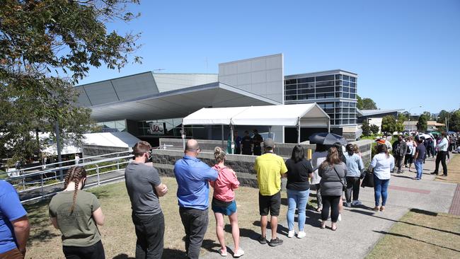 Locals line up for the Covid jab at the Logan Entertainment Centre. Picture: Zak Simmonds