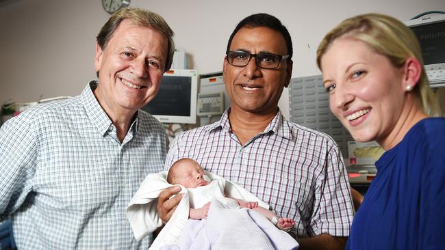 Ray Martin visits 3-week-old Raphael with neonatologist Rakesh Seth and mum Lara Fowler at Royal Darwin Hospital 