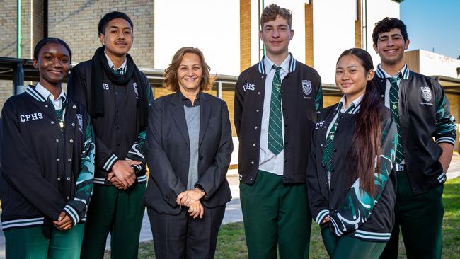 Ms Mobayed (third-left) with year 12 students. The principal said having arguments in person, away from phones, helped development. Picture: Christian Gilles