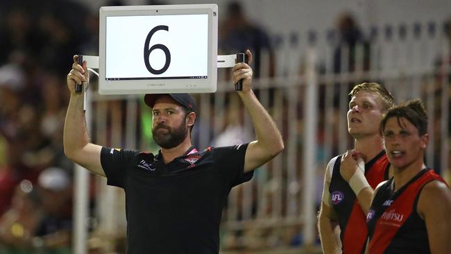 MELBOURNE, AUSTRALIA - FEBRUARY 28: A Bombers official holds one of the electronic bench screens during the 2019 JLT Community Series AFL match between the Carlton Blues and the Essendon Bombers at Ikon Park on February 28, 2019 in Melbourne, Australia. (Photo by Scott Barbour/Getty Images)